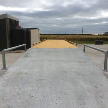 Surface mounted Eurodeck weighbridge installed with barriers